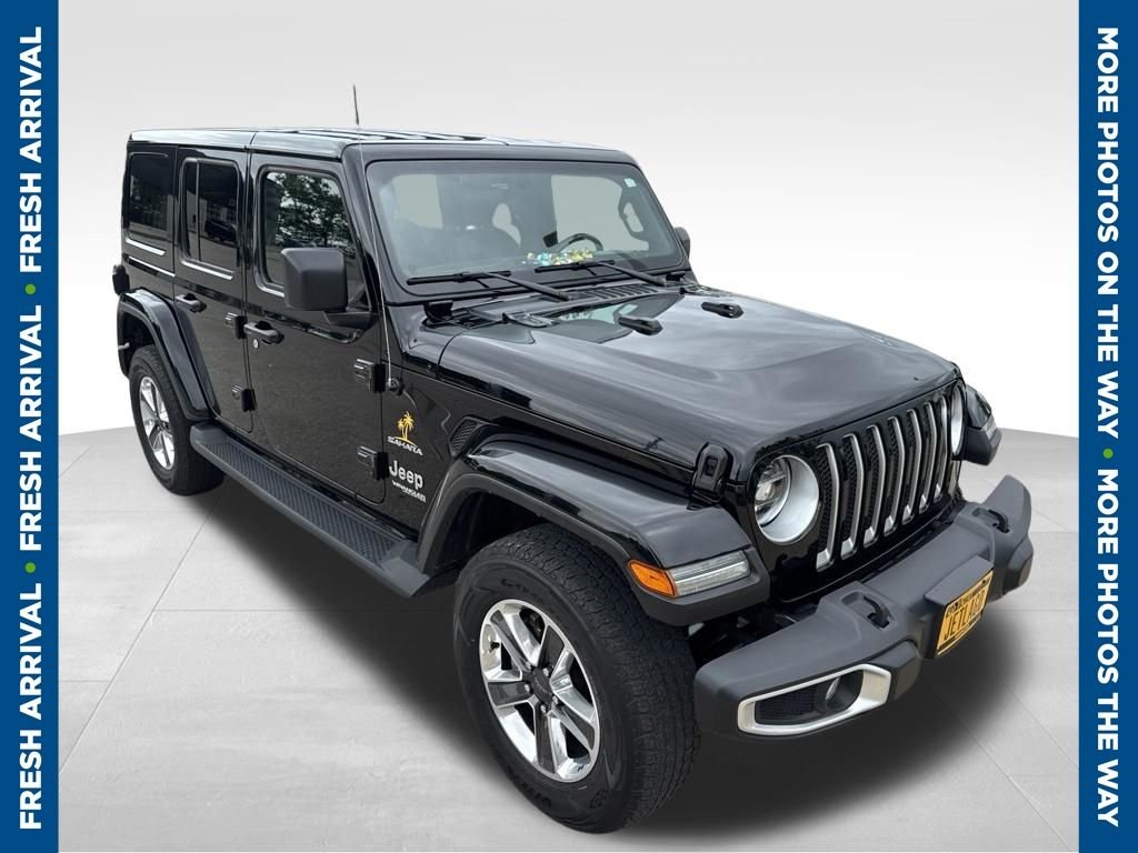 Used 2022 Black Jeep Unlimited Sahara image 1