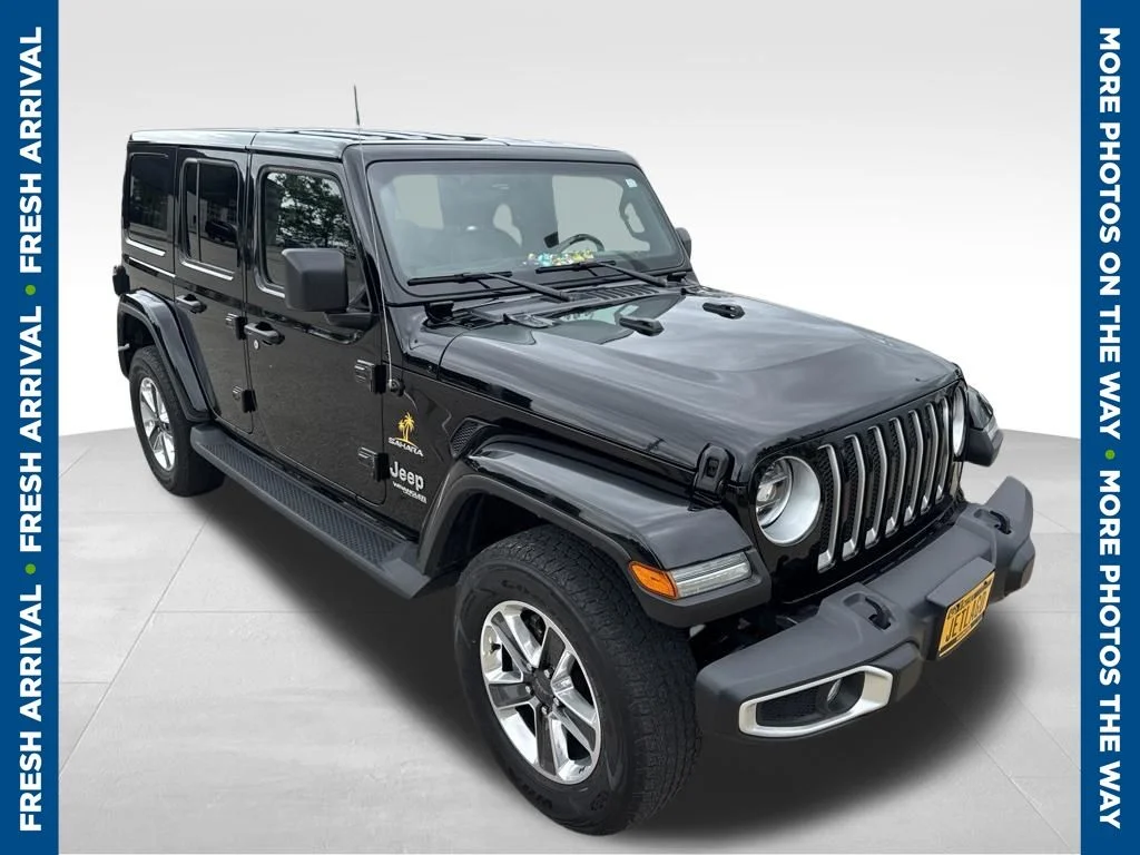 Used 2022 Black Jeep Unlimited Sahara image 1