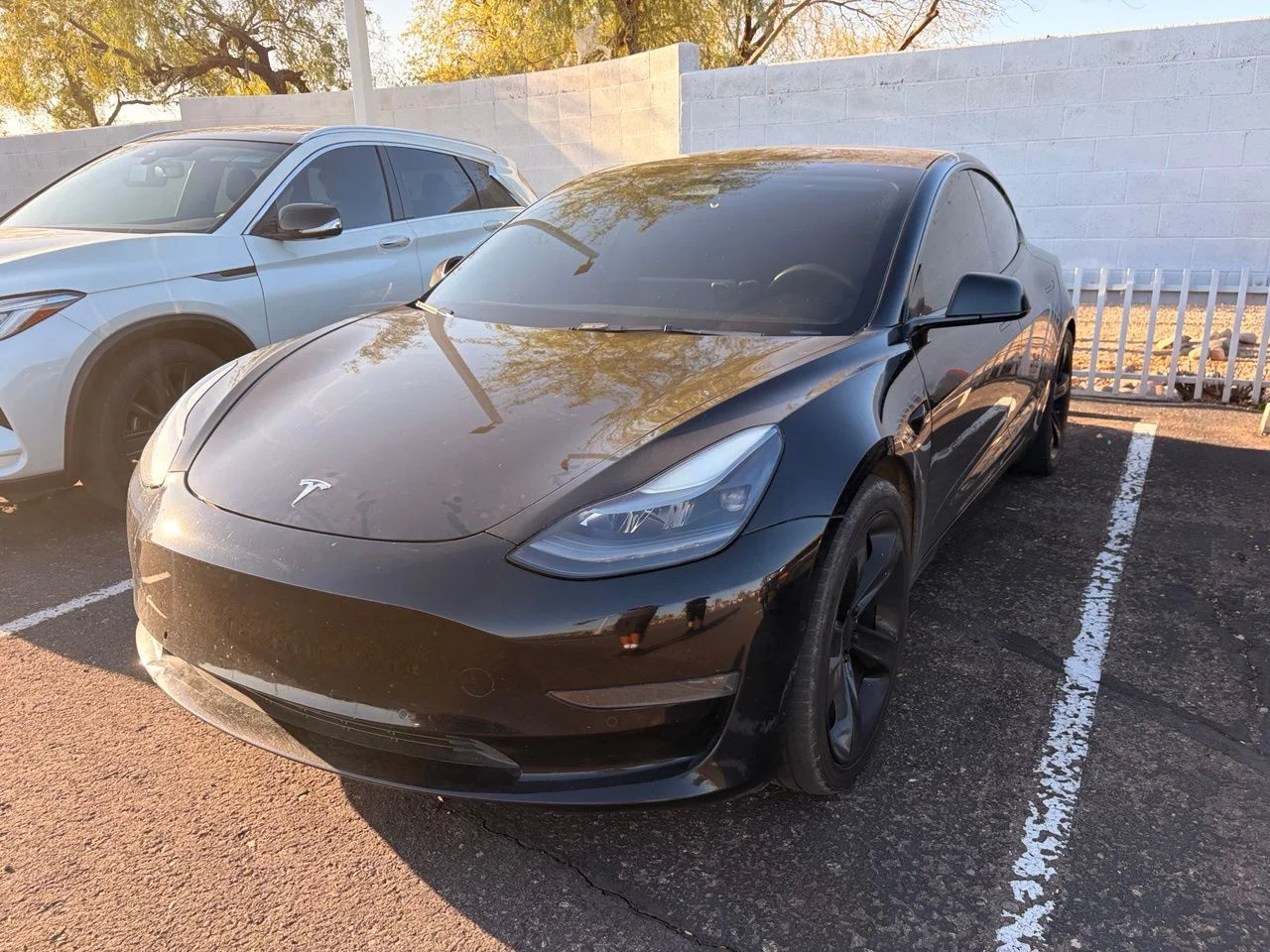 Used 2022 Solid Black Tesla Base image 1