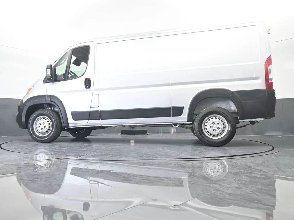 Used 2025 Bright Silver Clearcoat Metallic Ram Low Roof image 48