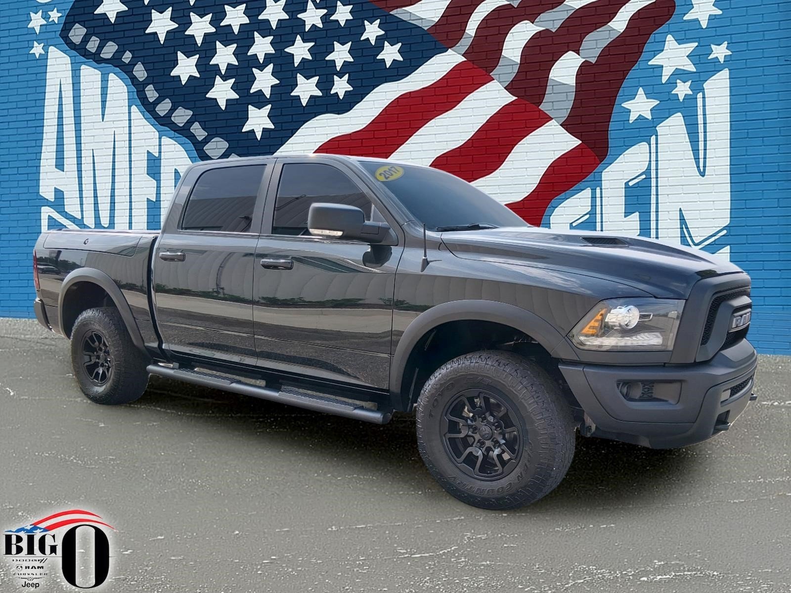 Used 2017 Brilliant Black Crystal Pearl Coat Ram 4x4 Rebel 4dr Crew Cab 5.5 ft. SB Pickup image 1