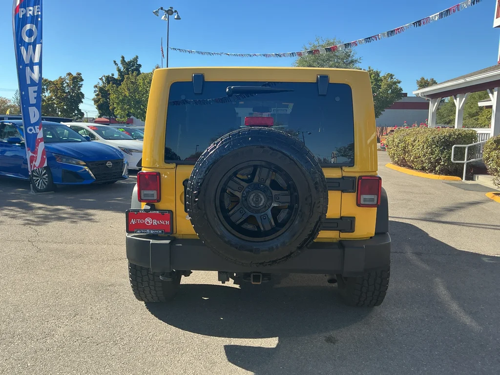 Used 2015 Baja Yellow Jeep Sport image 6