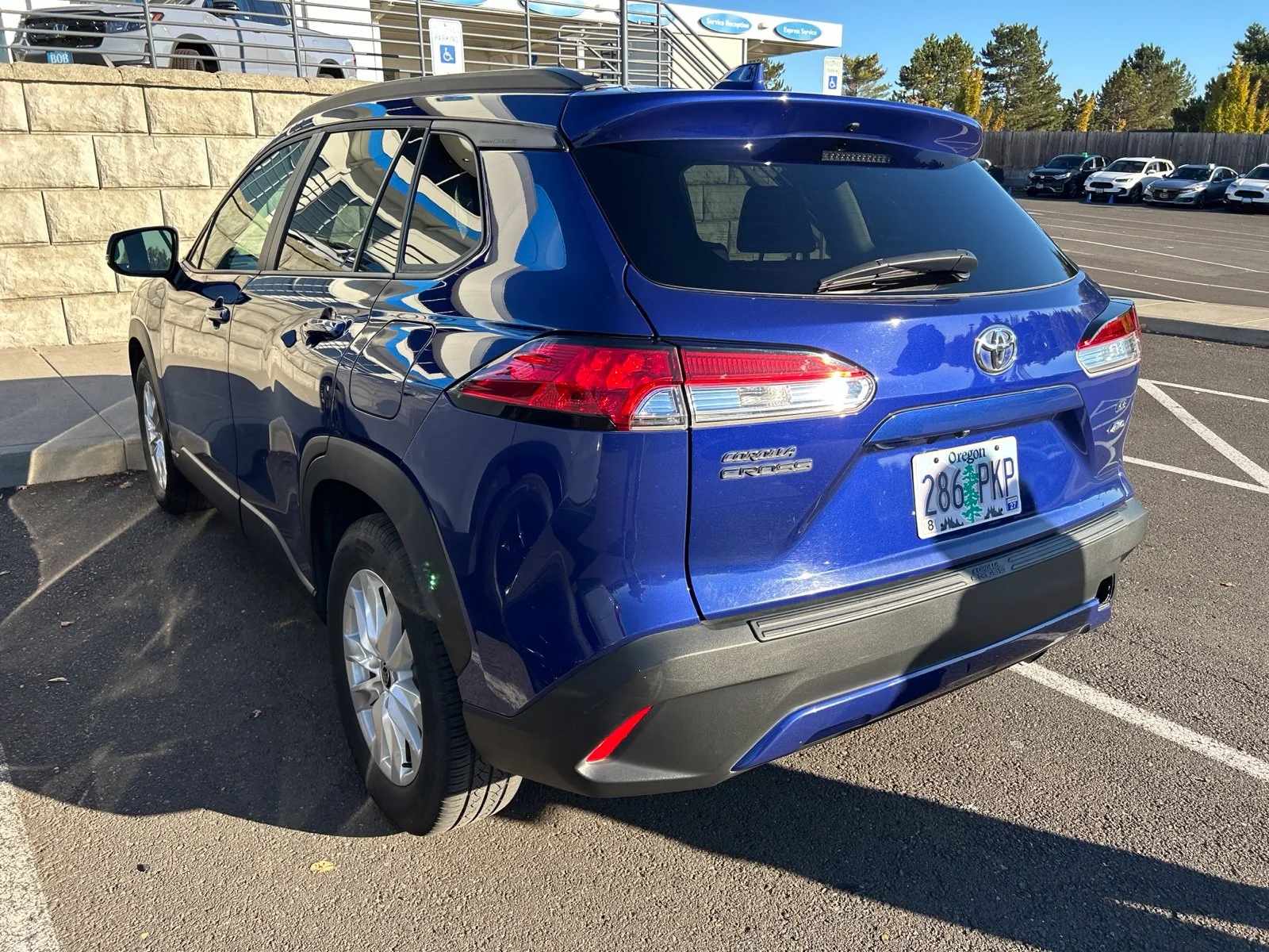 Used 2022 Blue Crush Metallic Toyota LE image 6