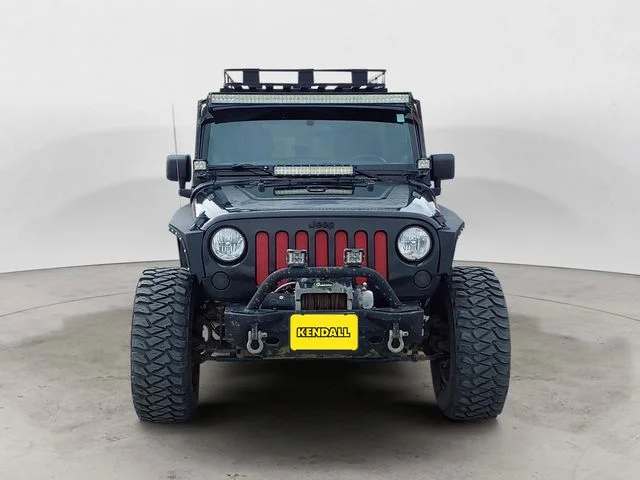 Used 2012 Black Jeep Unlimited Sahara Altitude image 8