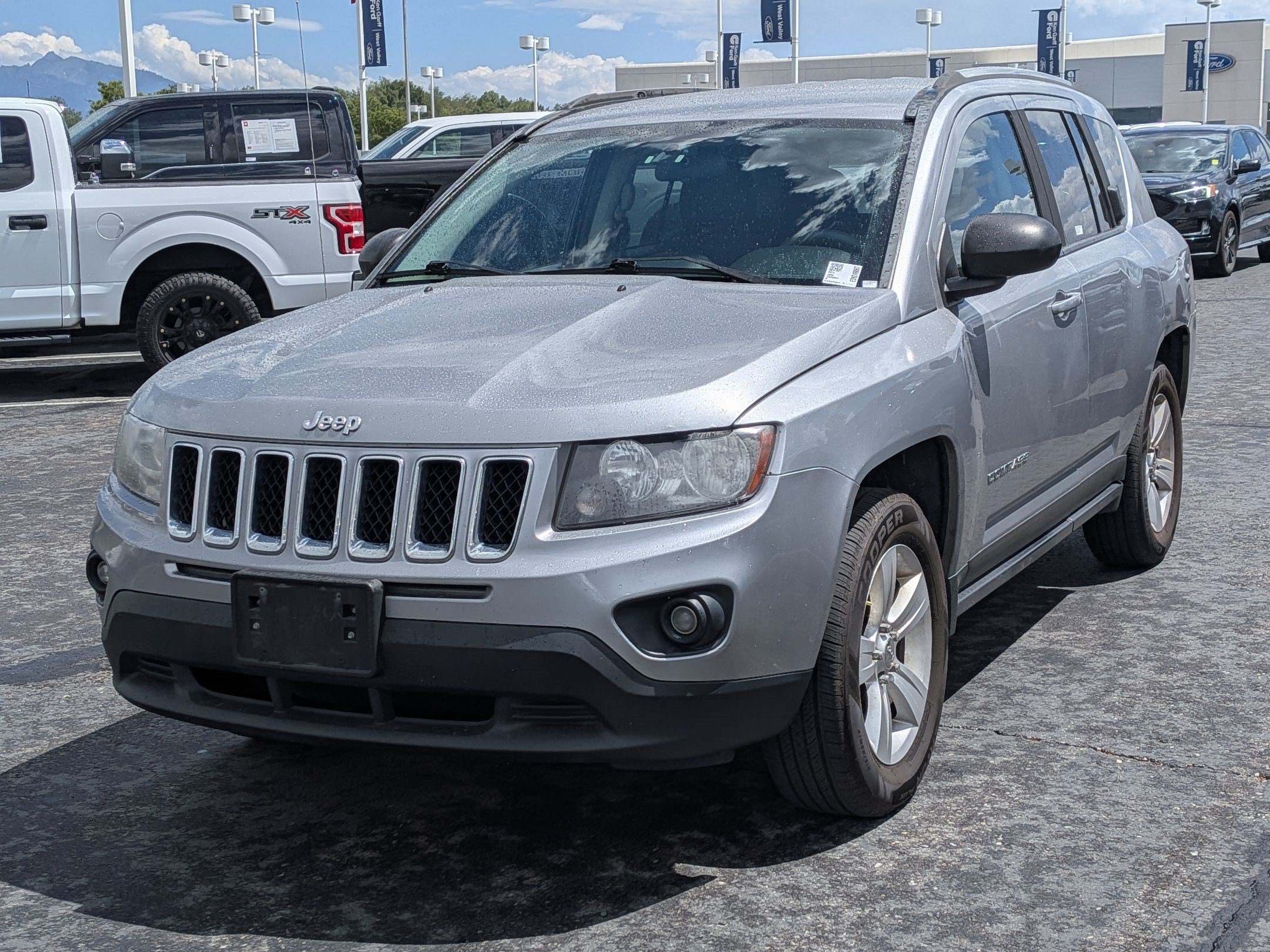 Used 2014 Billet Silver Clearcoat Metallic Jeep Sport image 8