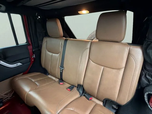 Used 2013 Red Jeep Unlimited Sahara image 19