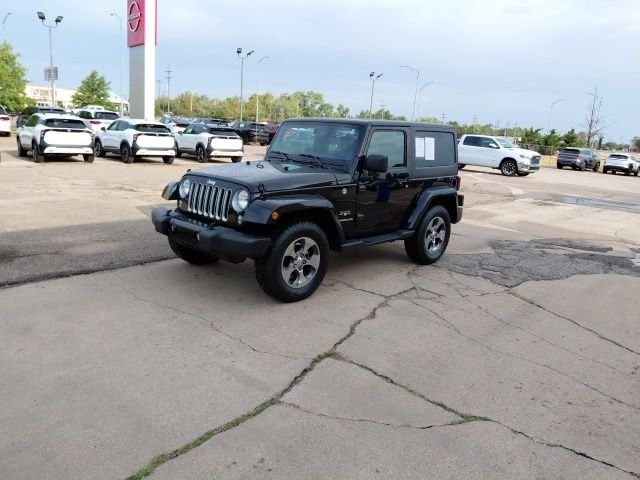 Used 2016 Black Clearcoat Jeep Sahara image 8