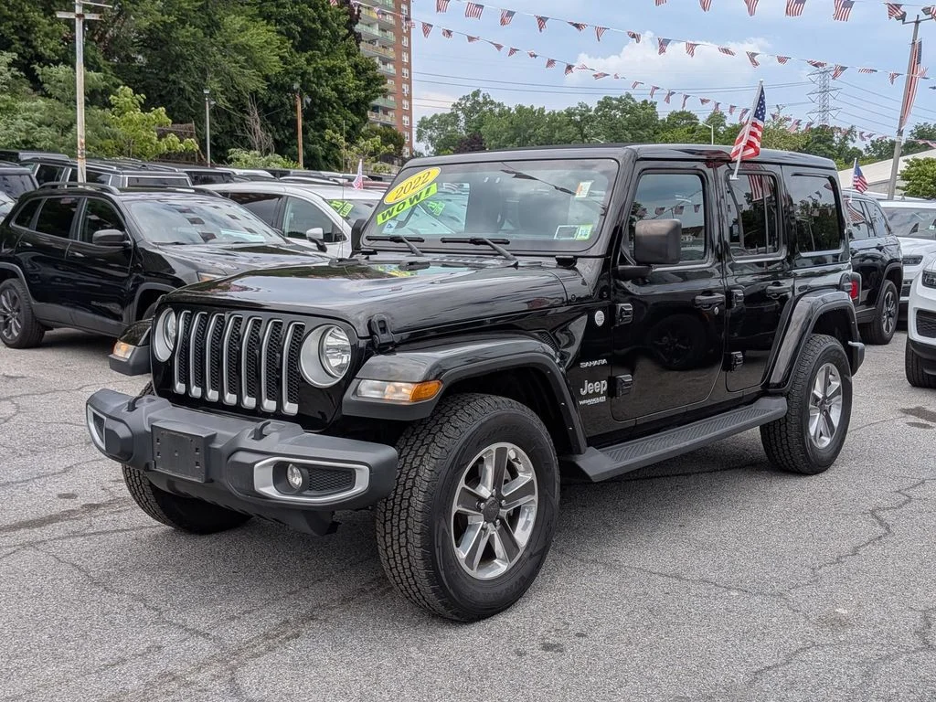 Used 2022 Black Jeep Unlimited Sahara image 1