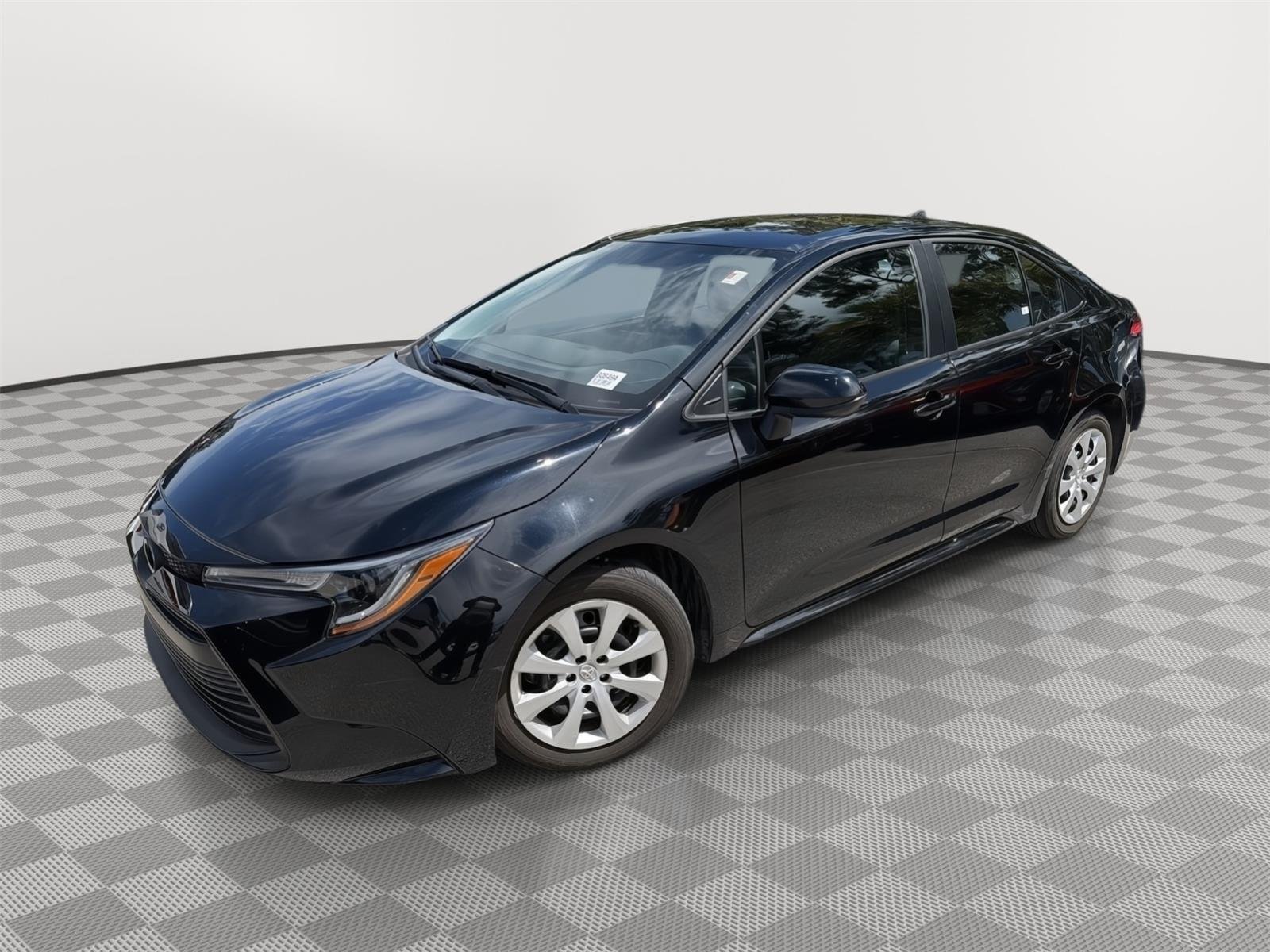 Used 2024 Midnight Black Metallic Toyota LE image 1