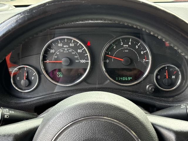 Used 2015 Orange Jeep Sahara image 23
