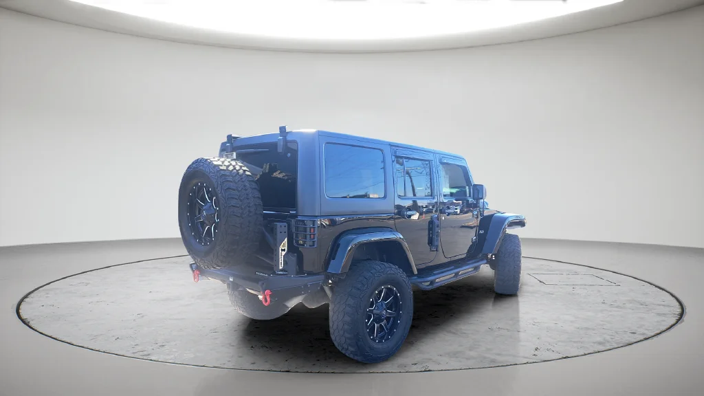 Used 2015 Black Jeep Unlimited Sahara image 4
