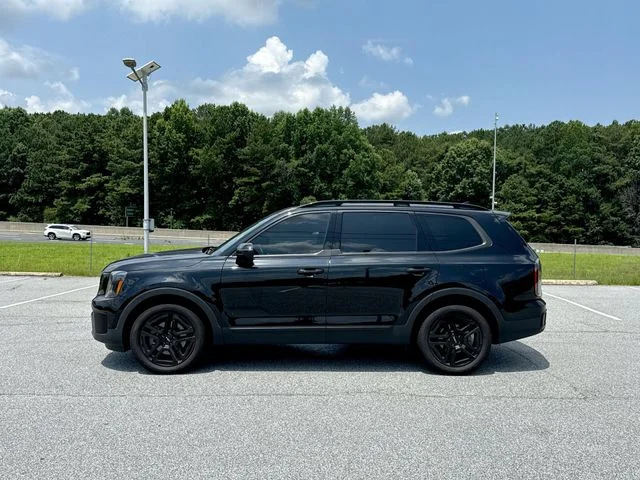 Used 2024 Black Kia EX X-Line image 2
