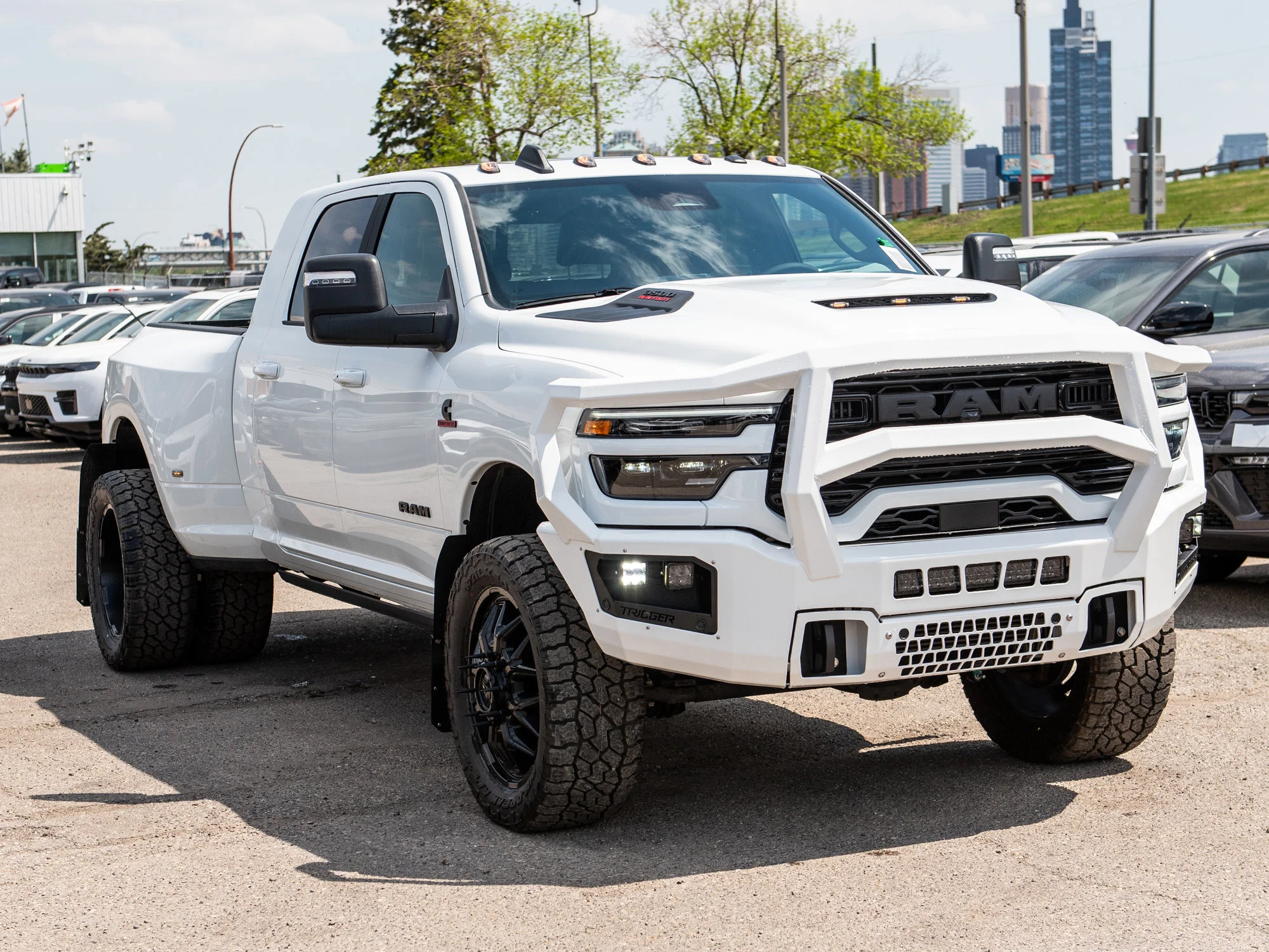 New 2026 White RAM Laramie* Mega Cab, 2 Inch Lift, 35 Inch Tires, Trigger Industries Bumper image 14