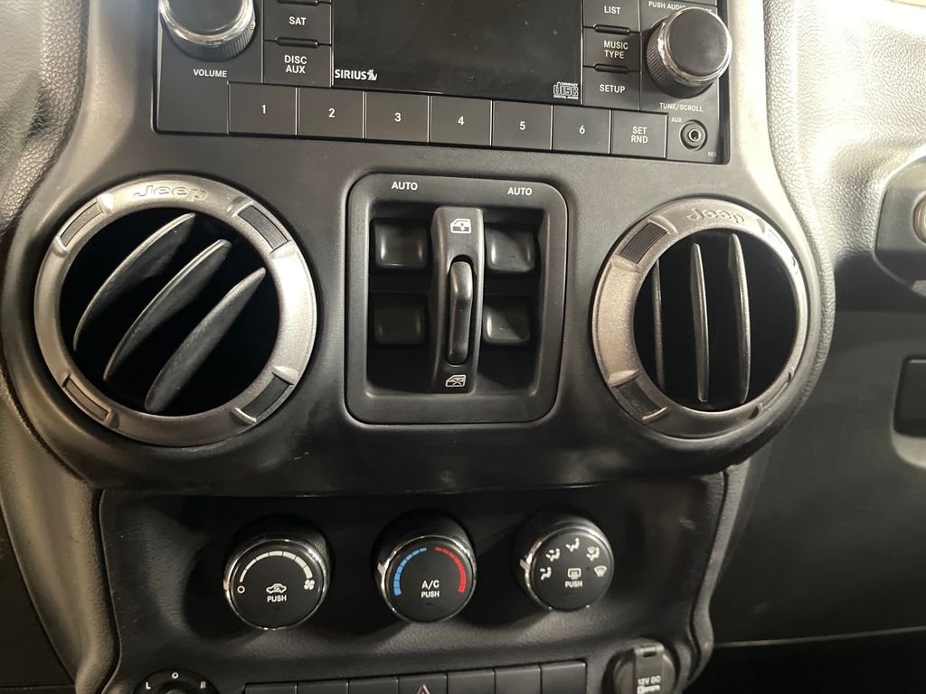 Used 2013 Black Jeep Unlimited Sport image 16