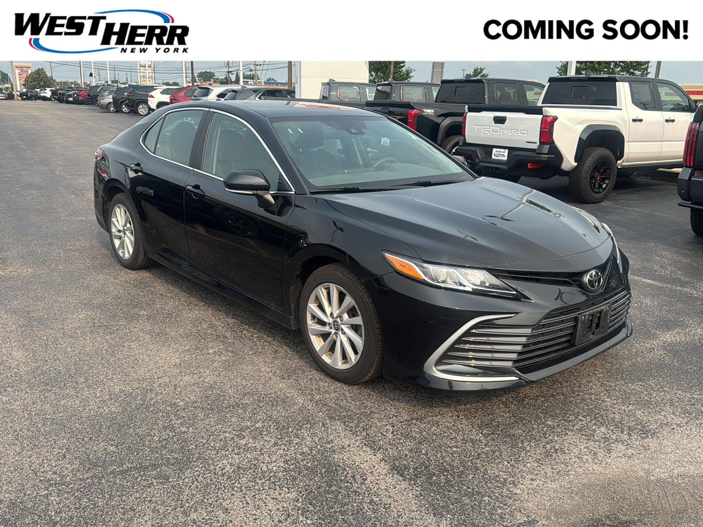 Used 2021 Midnight Black Metallic Toyota LE image 1