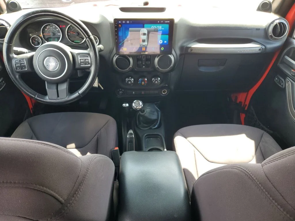 Used 2013 Red Jeep Unlimited Sport image 12