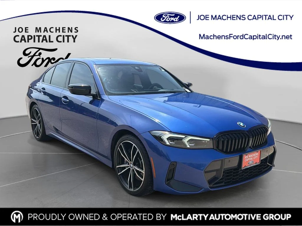 Used 2023 Portimao Blue Metallic BMW 330i xDrive image 1