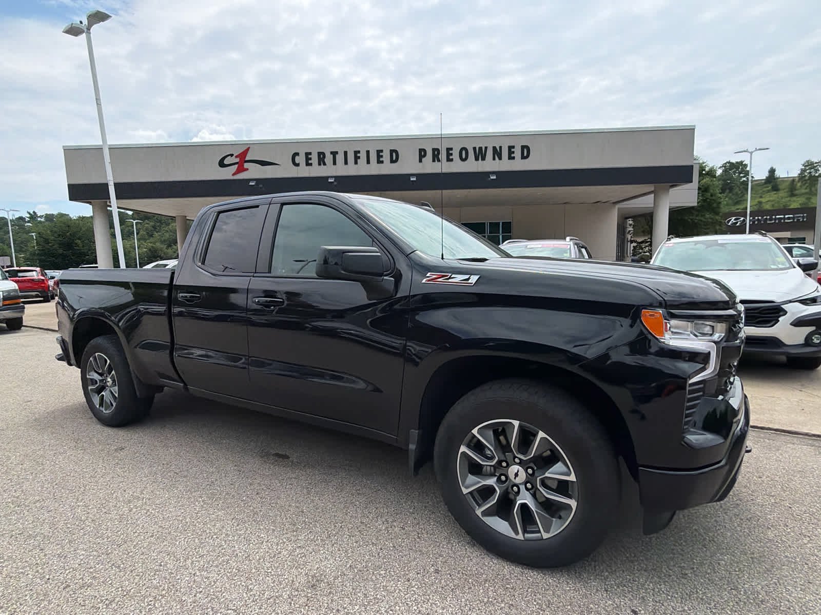 Certified Used 2024 Black Chevrolet RST image 1