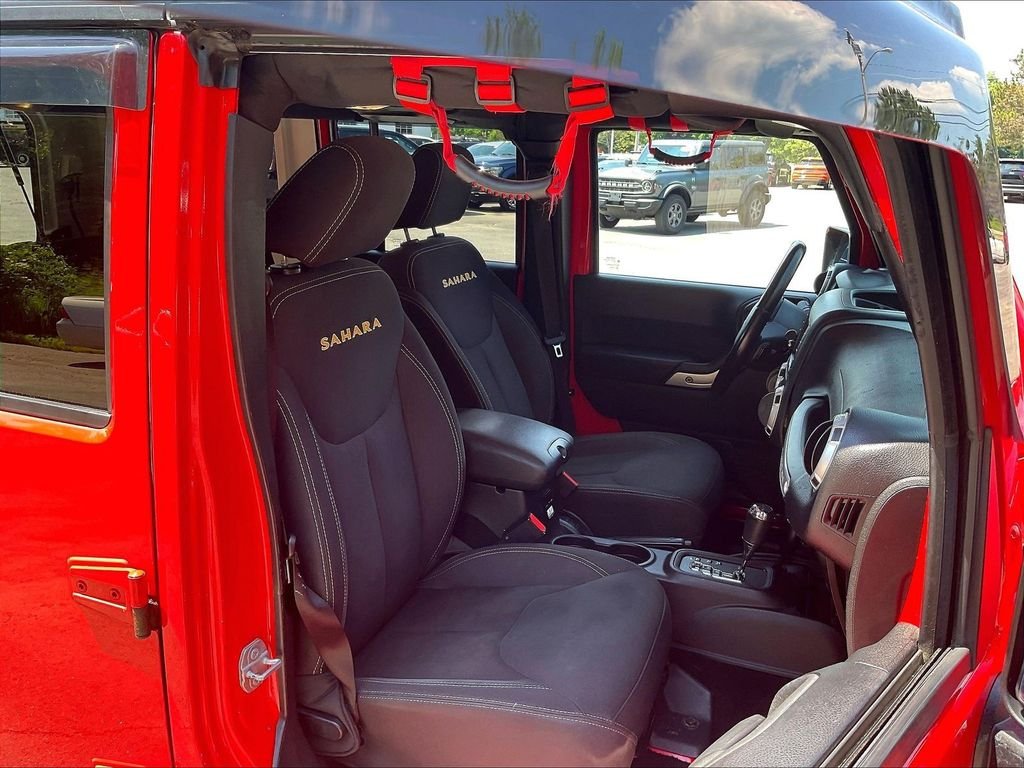 Used 2015 Red Jeep Unlimited Sahara image 11