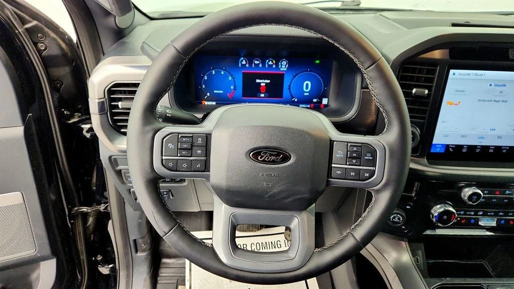 Used 2025 Agate Black Metallic Ford LARIAT 4WD SuperCrew 5.5