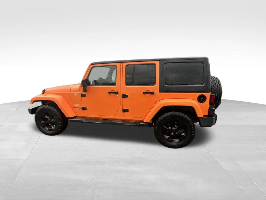 Used 2013 Orange Jeep Unlimited Sahara image 7
