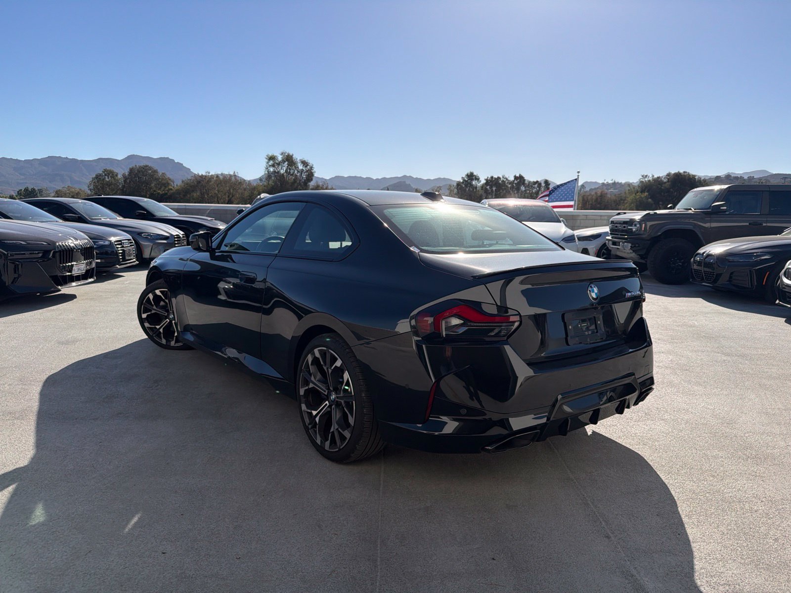 Used 2025 Black Sapphire Metallic BMW M240i image 2
