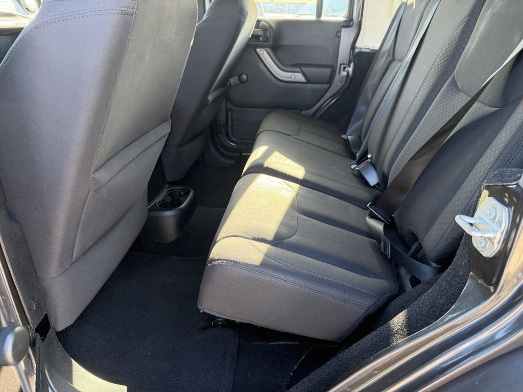 Used 2016 Granite Crystal Clearcoat Metallic Jeep Unlimited Sport image 21