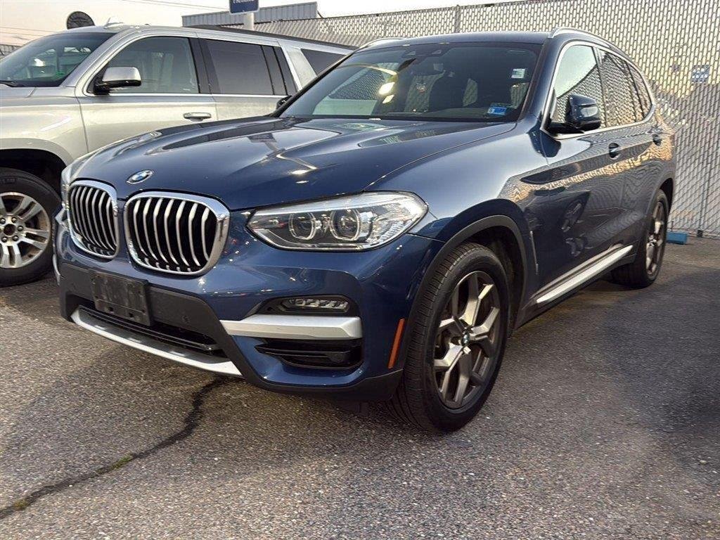 Used 2021 Phytonic Blue Metallic BMW xDrive30i image 1