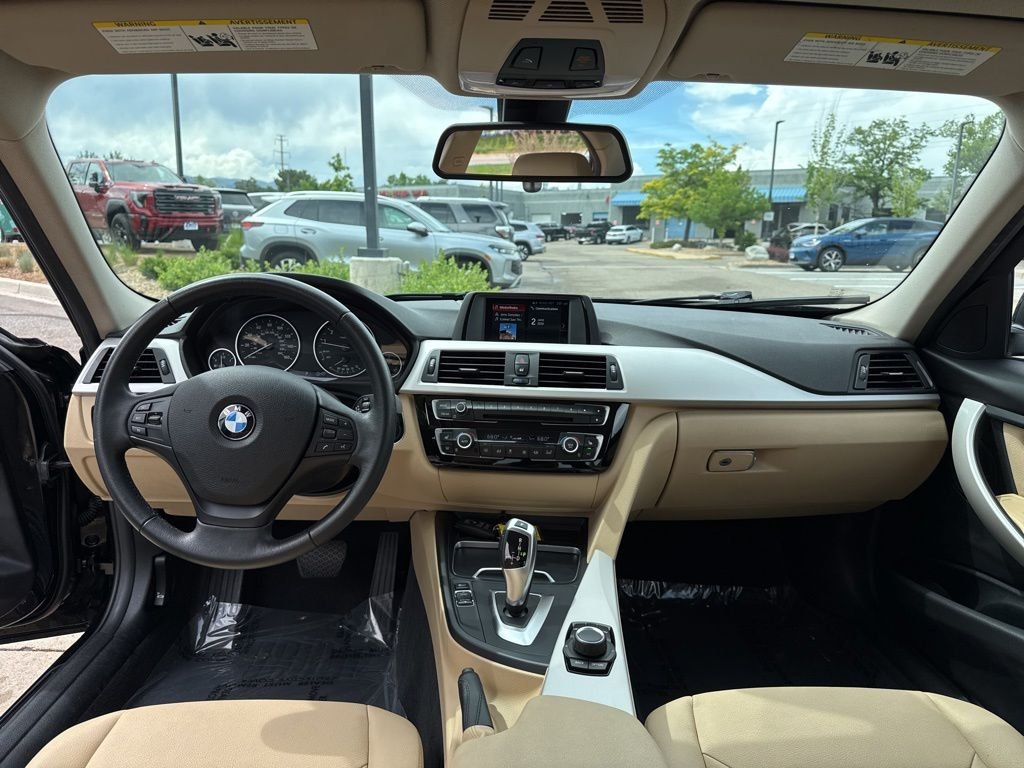 Used 2018 Black Sapphire Metallic BMW 320i xDrive image 12
