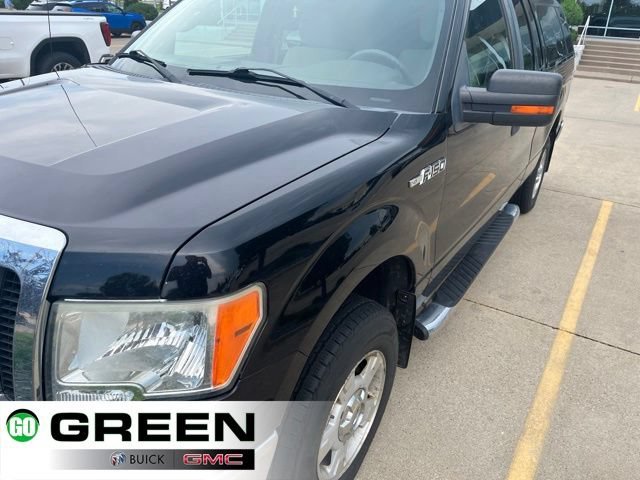 Used 2009 Black Ford XL image 1