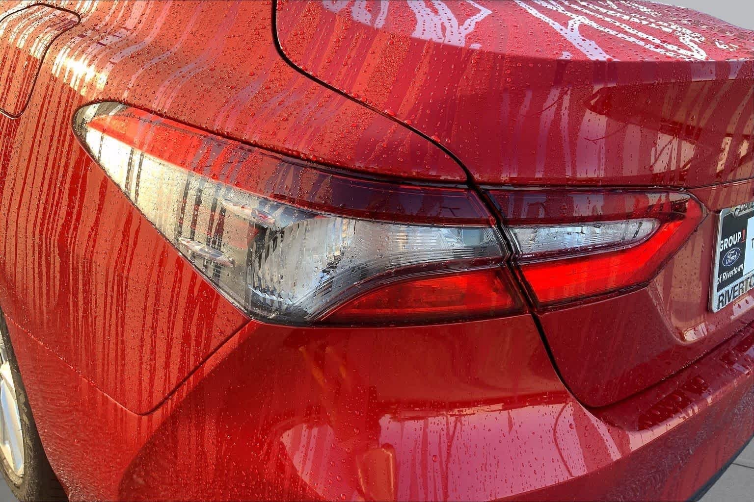 Used 2024 Supersonic Red Toyota LE image 26
