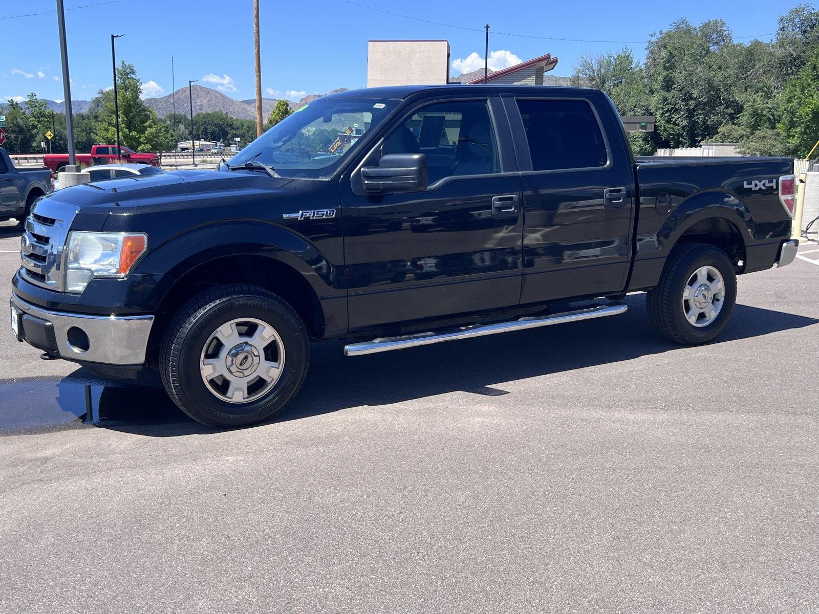 Used 2011 Tuxedo Black Metallic Ford XLT image 1