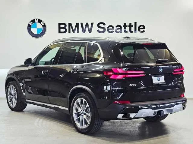 Used 2025 Black Sapphire Metallic BMW xDrive50e image 4