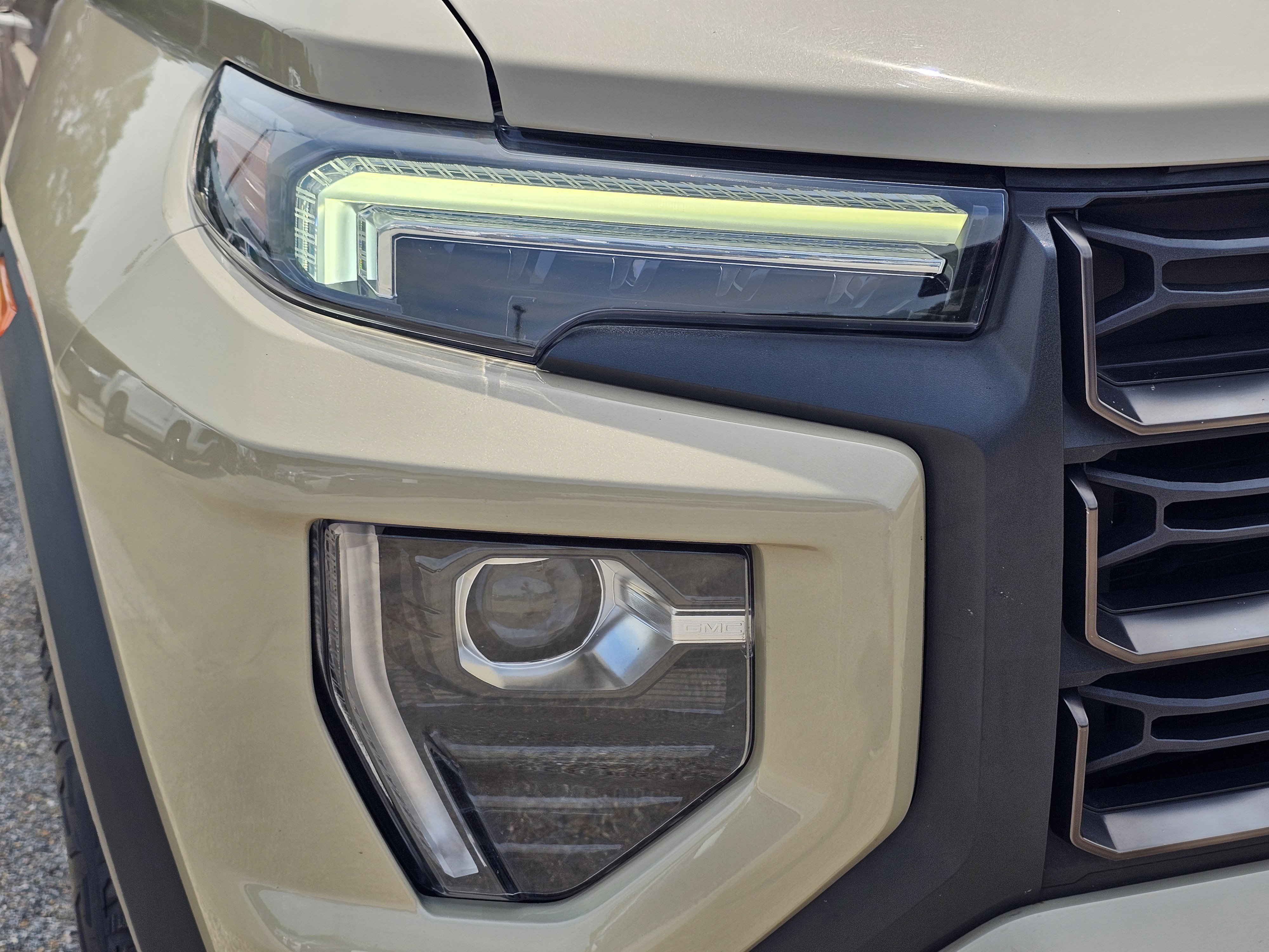 Used 2023 Desert Sand Metallic GMC 4WD AT4X image 4