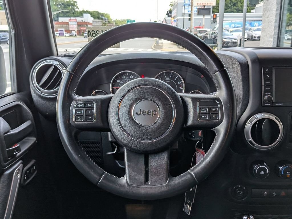 Used 2016 Black Jeep Unlimited Sahara image 13