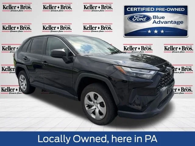 Used 2023 Midnight Black Metallic Toyota LE image 1