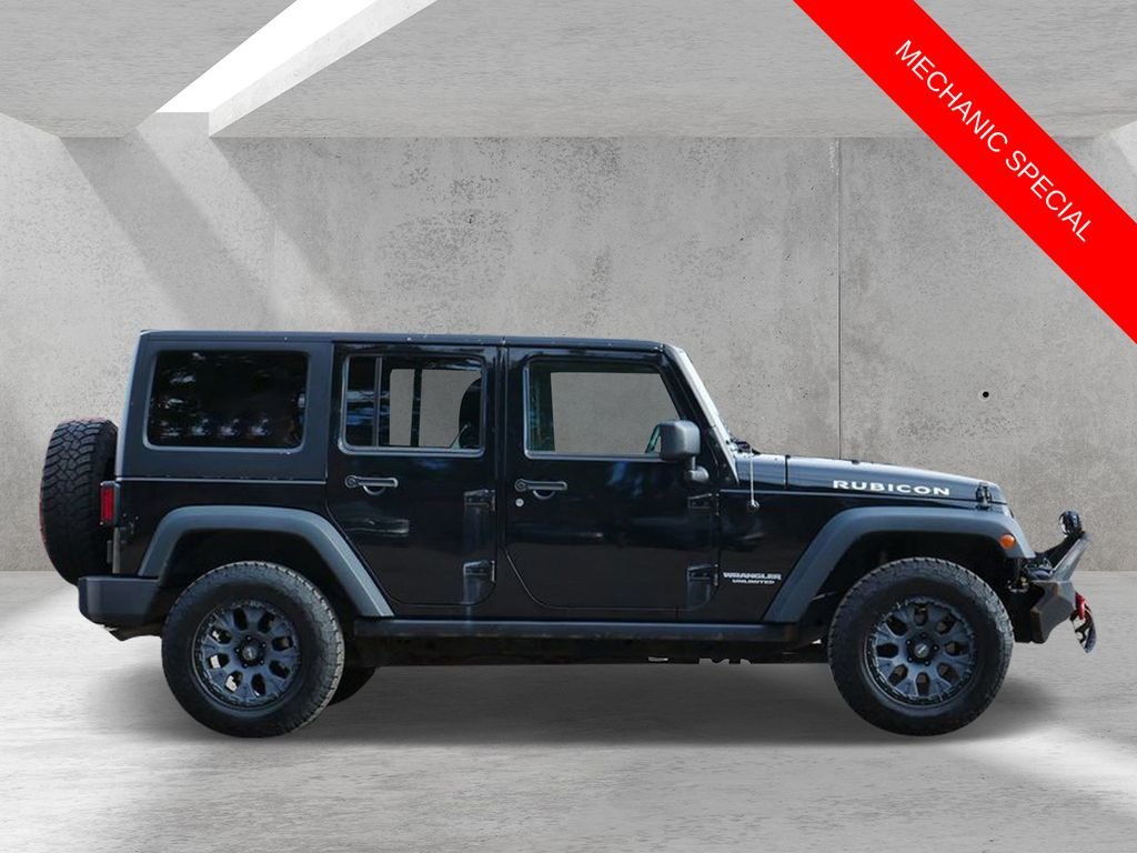 Used 2013 Jeep Wrangler Unlimited Rubicon with VIN 1C4HJWFGXDL607664 for sale in White Bear Lake, Minnesota