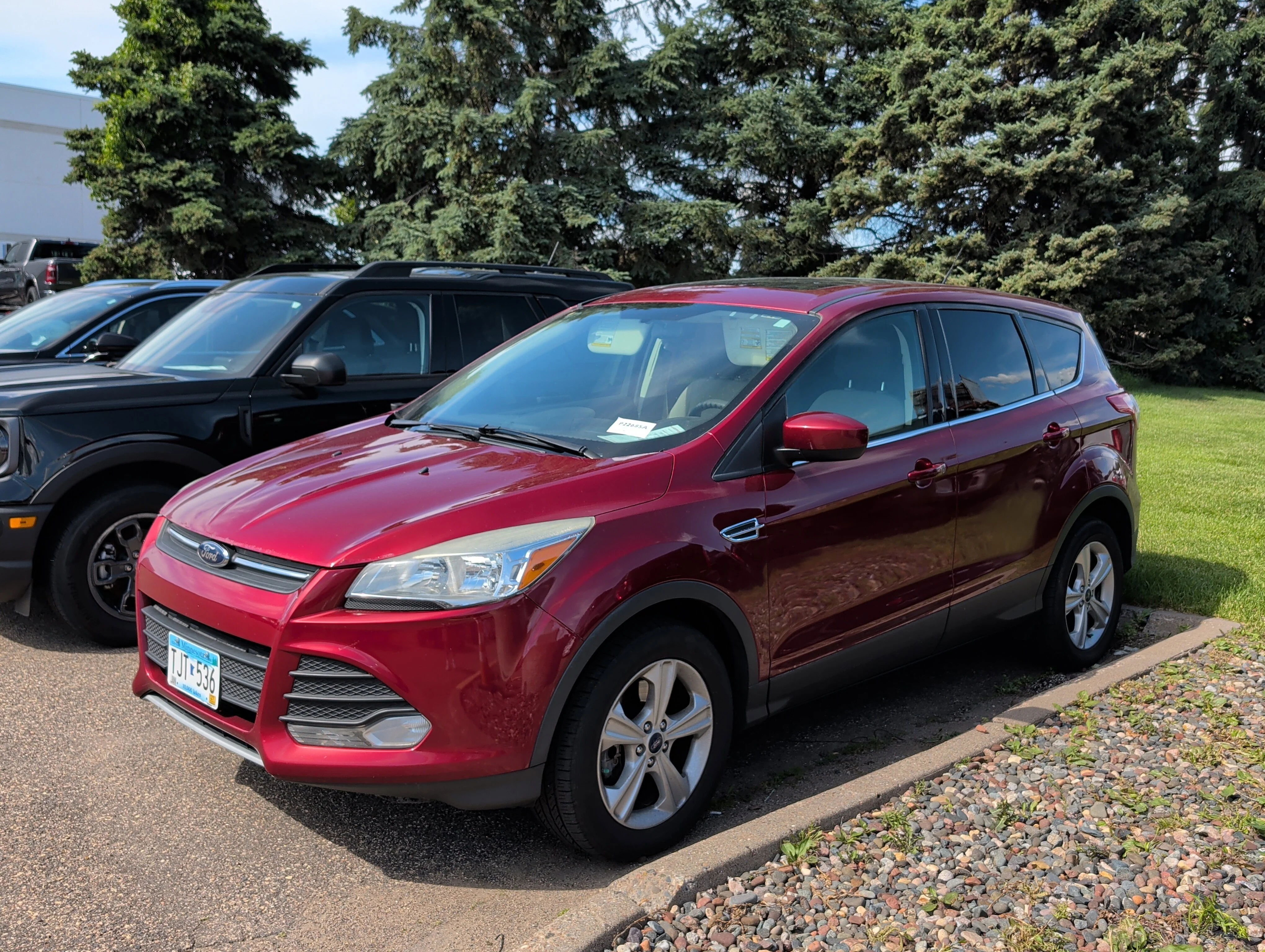 Used 2015 Ruby Red Metallic Tinted Clearcoat Ford SE image 4