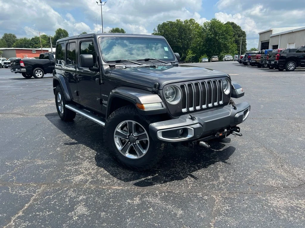 Used 2018 Granite Crystal Clearcoat Metallic Jeep Unlimited Sahara image 1
