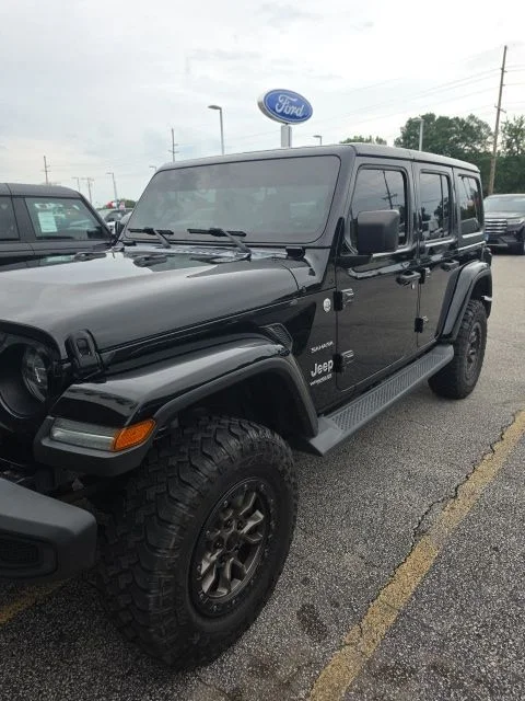 Used 2018 Black Jeep Unlimited Sahara image 1