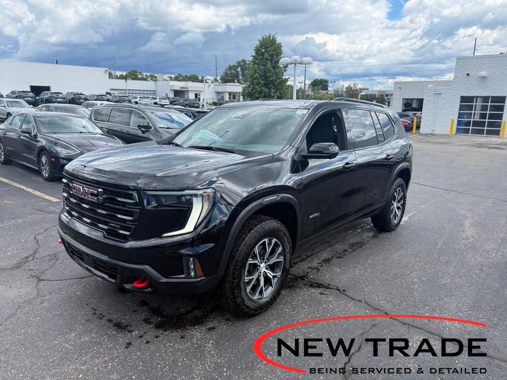 Used 2024 Ebony Twilight Metallic GMC AT4 image 1