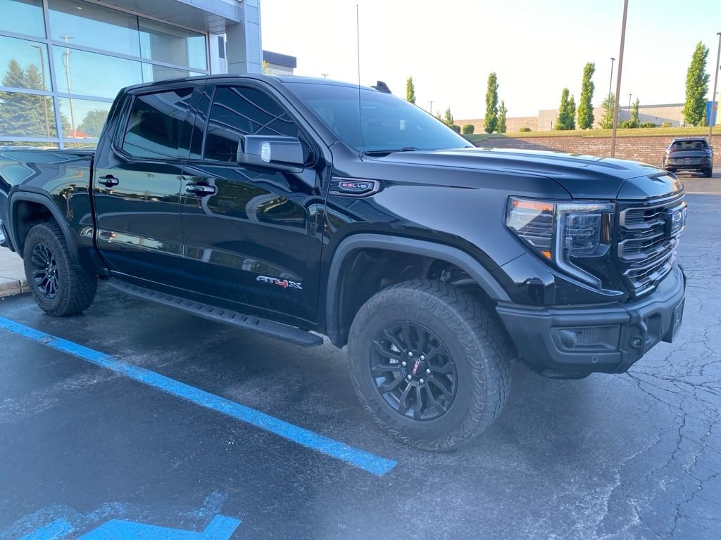 Used 2023 Onyx Black GMC AT4X image 1