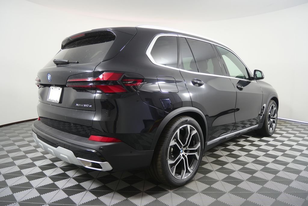 New 2026 Black Sapphire Metallic BMW xDrive50e image 4