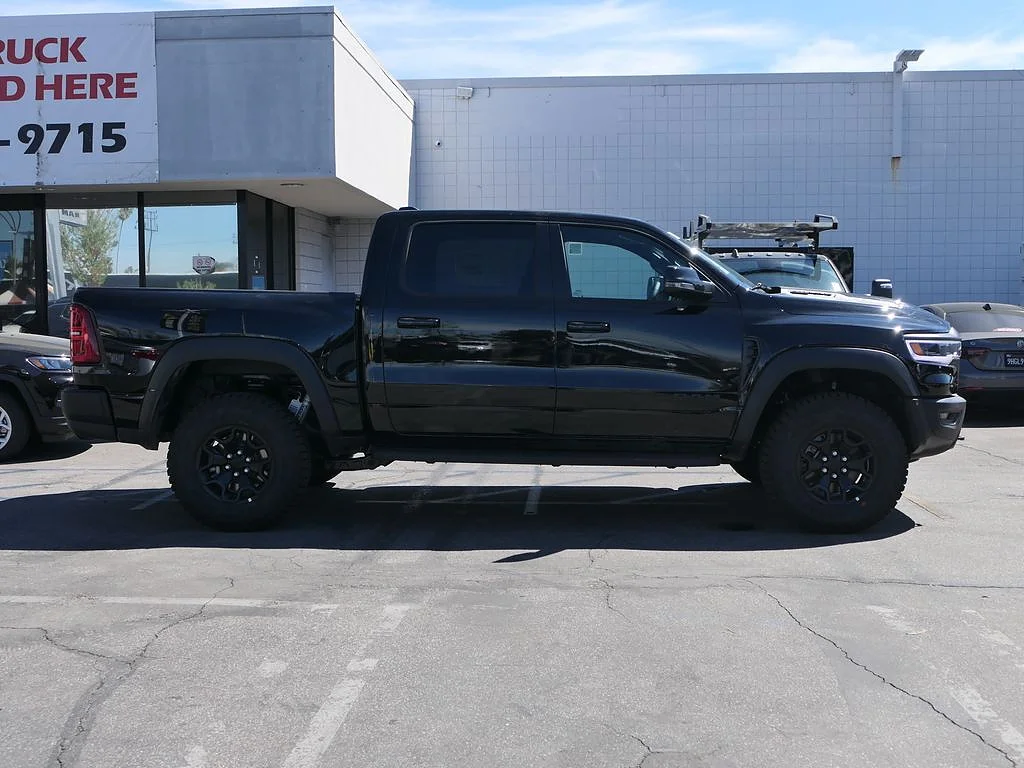 New 2026 Diamond Black Crystal Pearl Coat RAM RHO Crew Cab 4x4 5