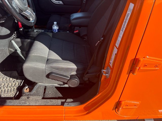 Used 2012 Orange Jeep Unlimited Sahara image 7
