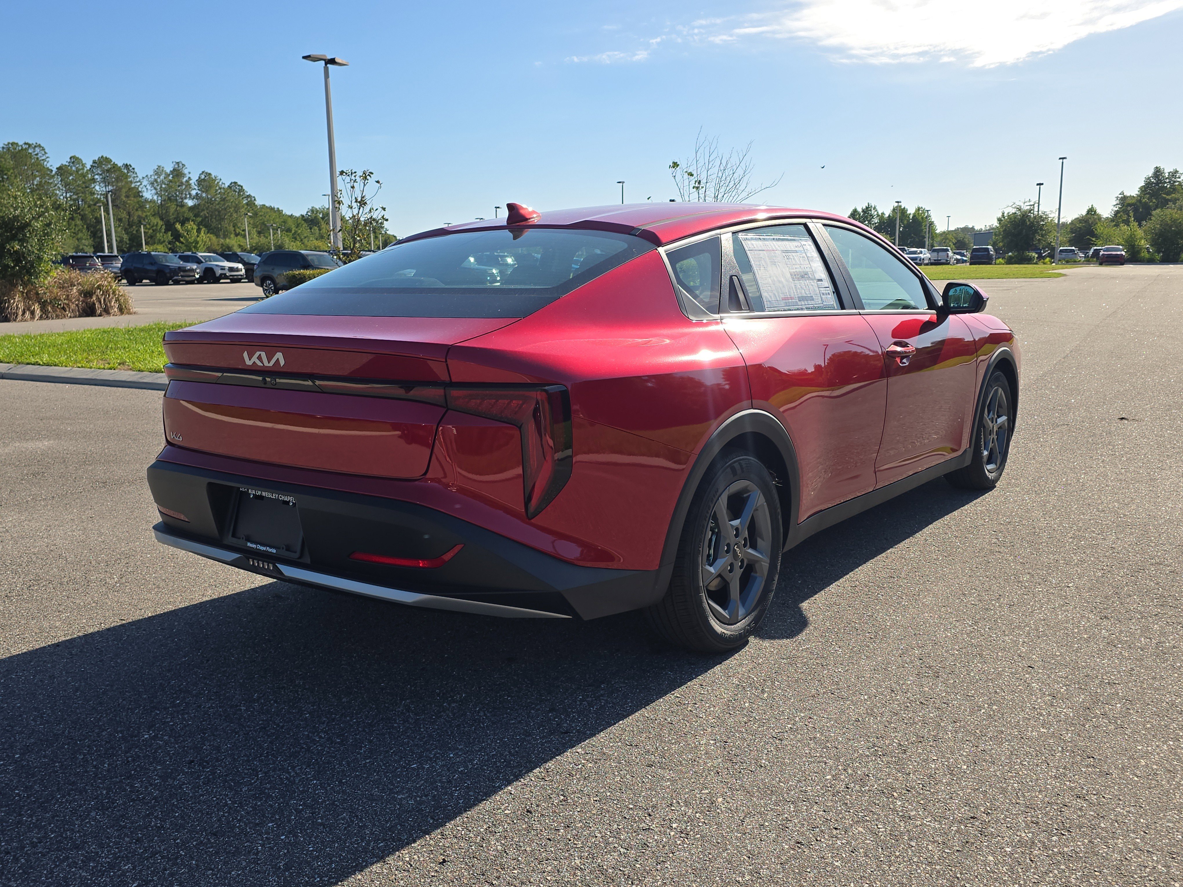 New 2026 Currant Red Kia LXS image 7