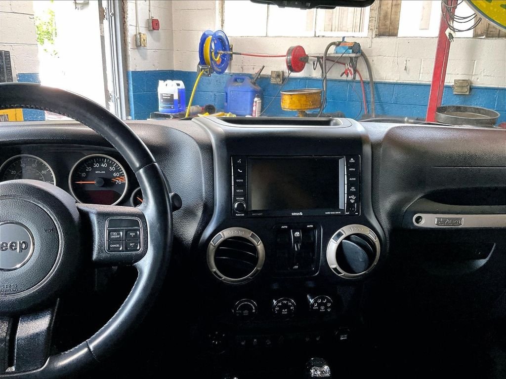 Used 2017 Black Jeep Unlimited Sahara image 17