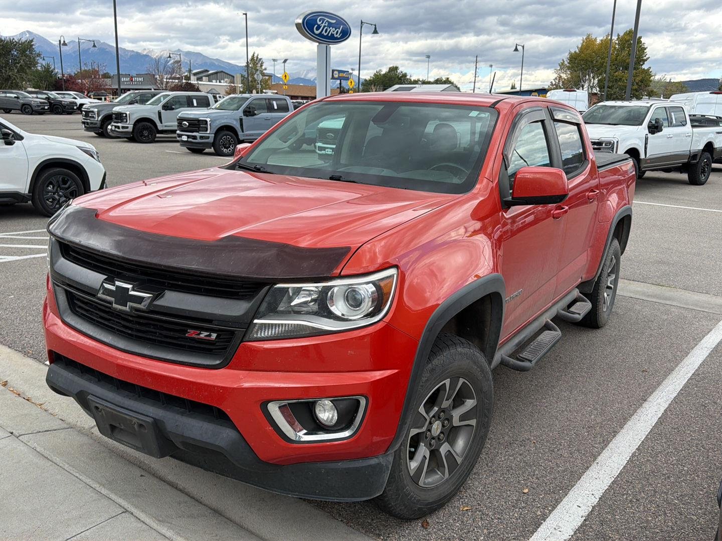 Used 2016 Inferno Orange Metallic Chevrolet 4WD Z71 image 1