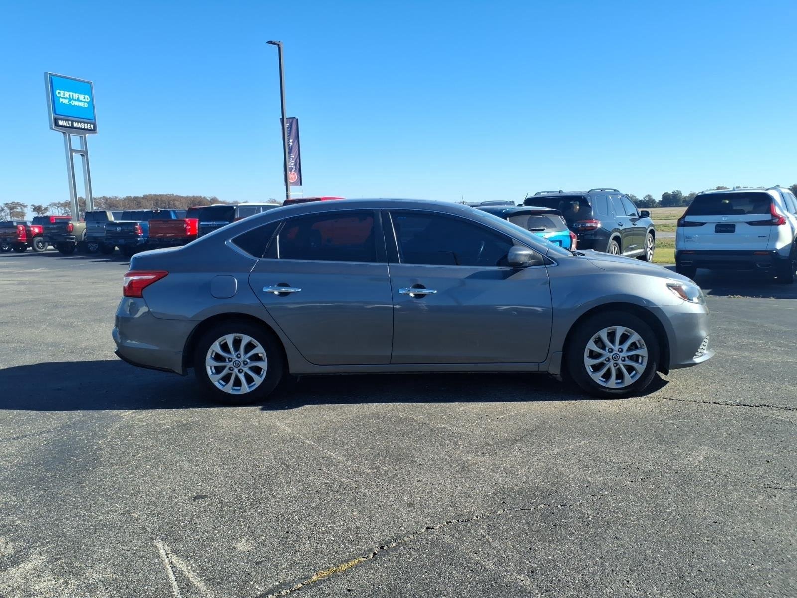 Used 2016 Gun Metallic Nissan SV image 6