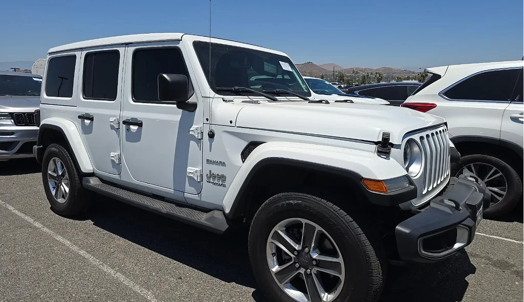 Used 2018 White Jeep Unlimited Sahara image 1